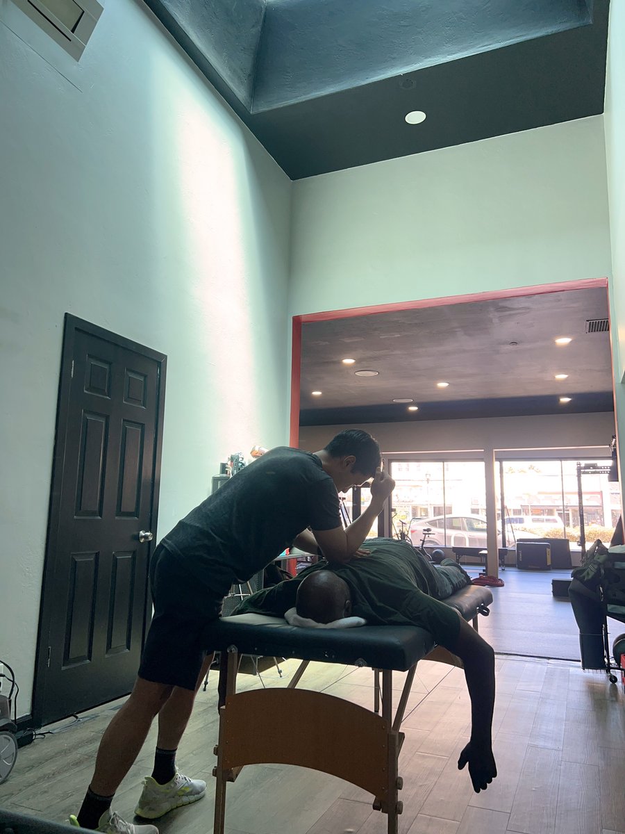 Philip Hsu performing hands-on manual therapy
